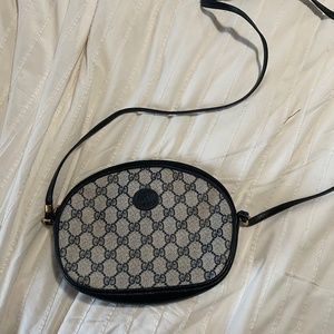 Small, vintage cross-body Gucci purse